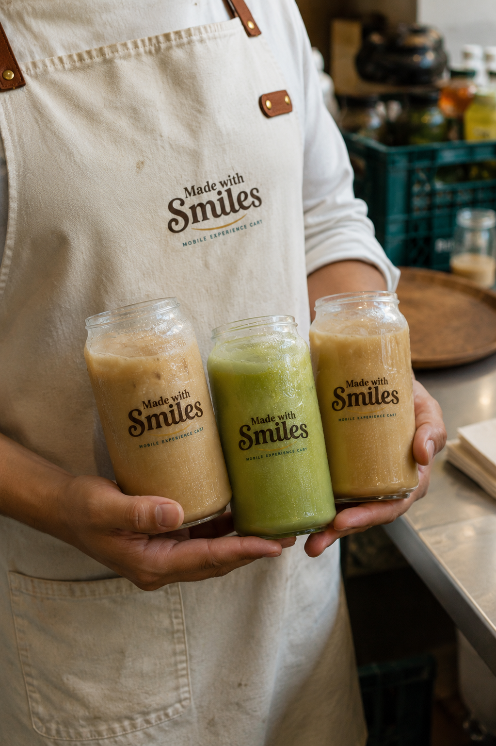Made with Smiles attendant presenting branded bottled coffee and matcha